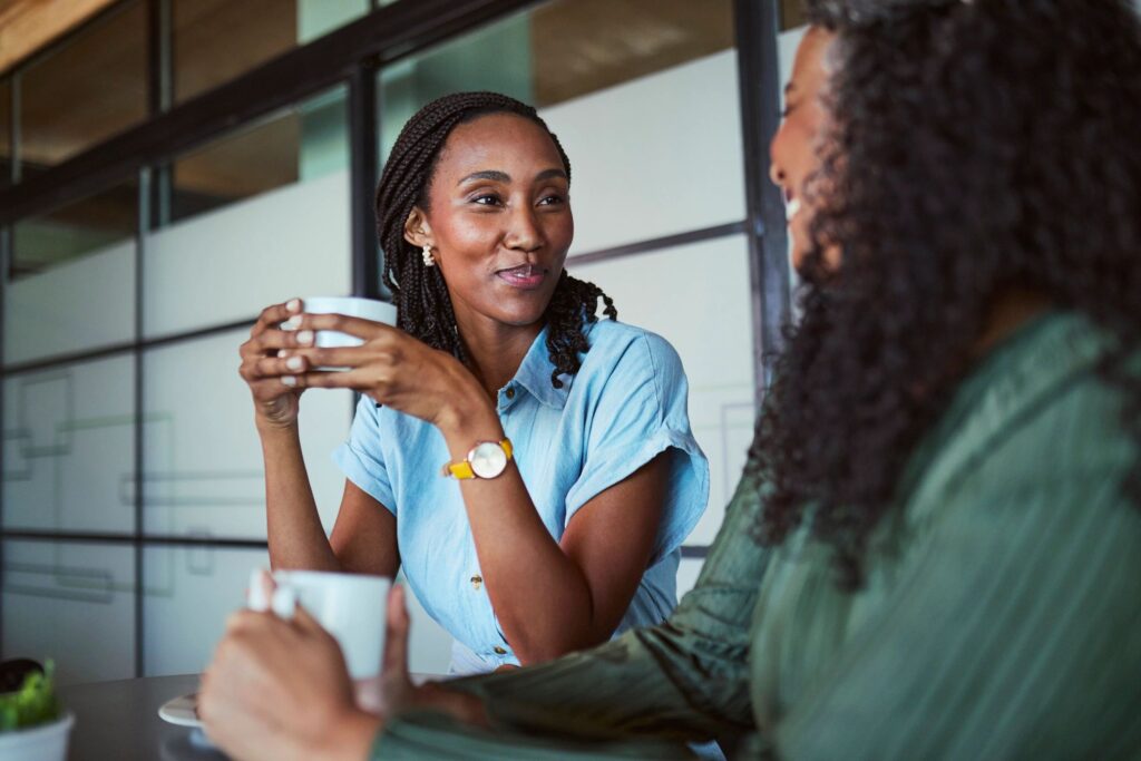 Attentive Black Businesswoman Listening During Coffee Conversation